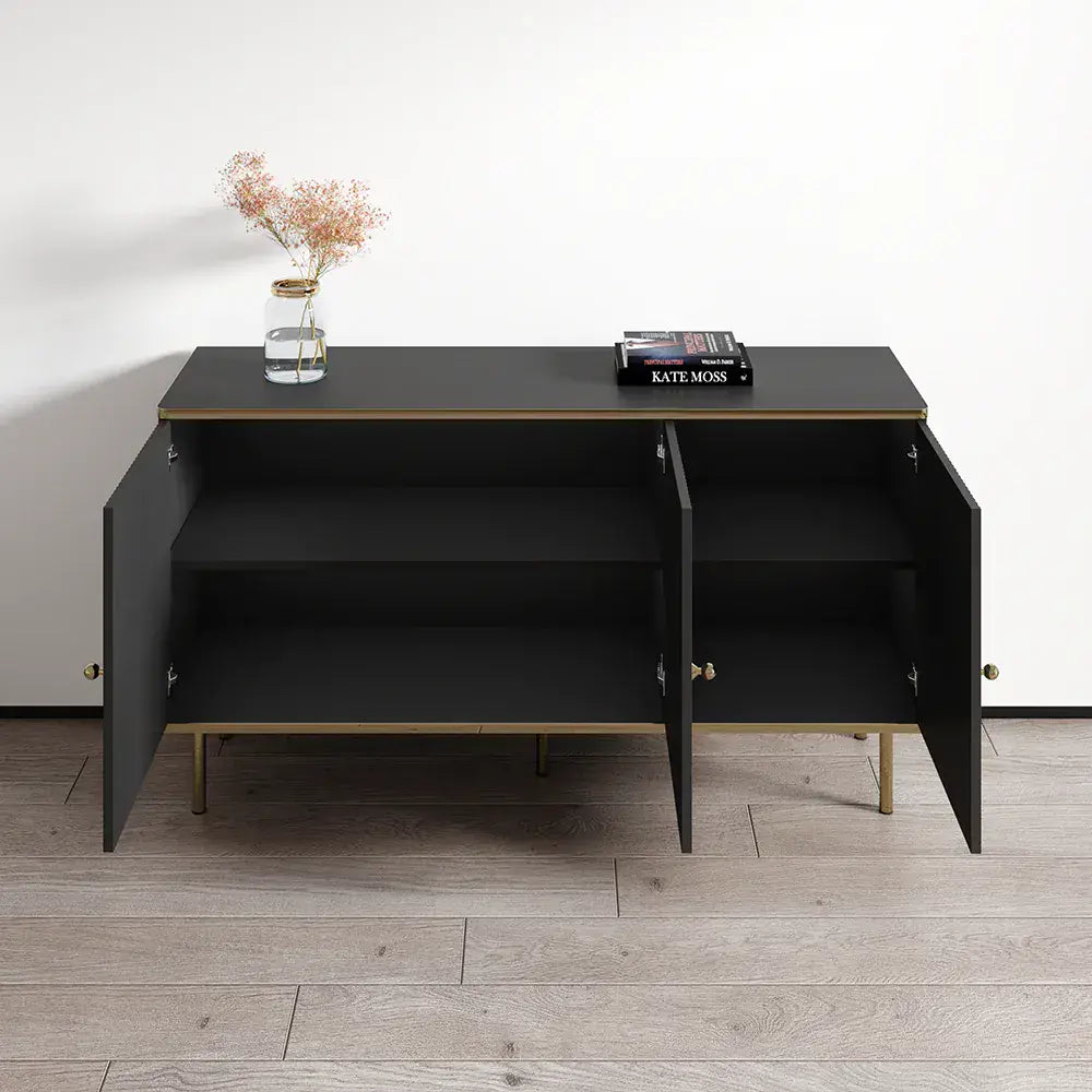 Black sideboard with open doors on a wooden floor against a white wall