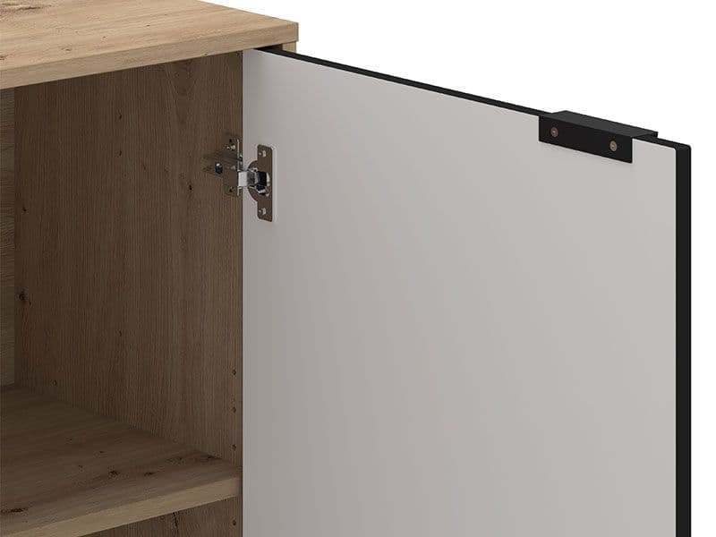 Wooden cabinet with a white door open, showing a hinge.