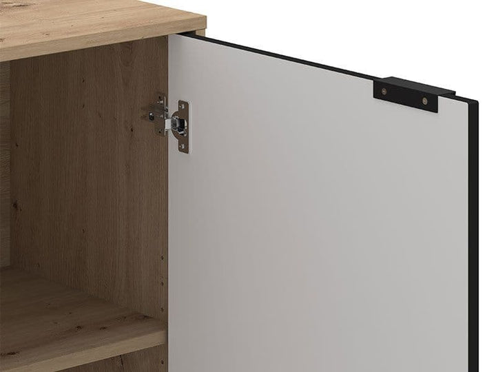 Wooden cabinet with a white door open, showing a hinge.