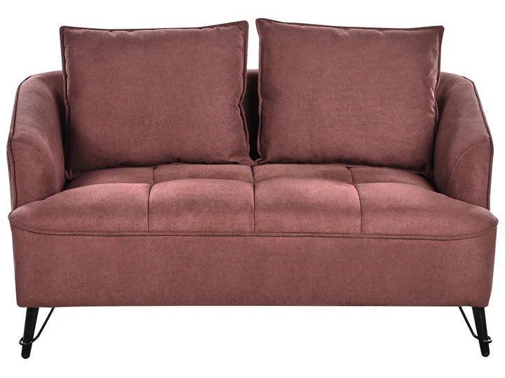 Pink sofa with two cushions on a white background