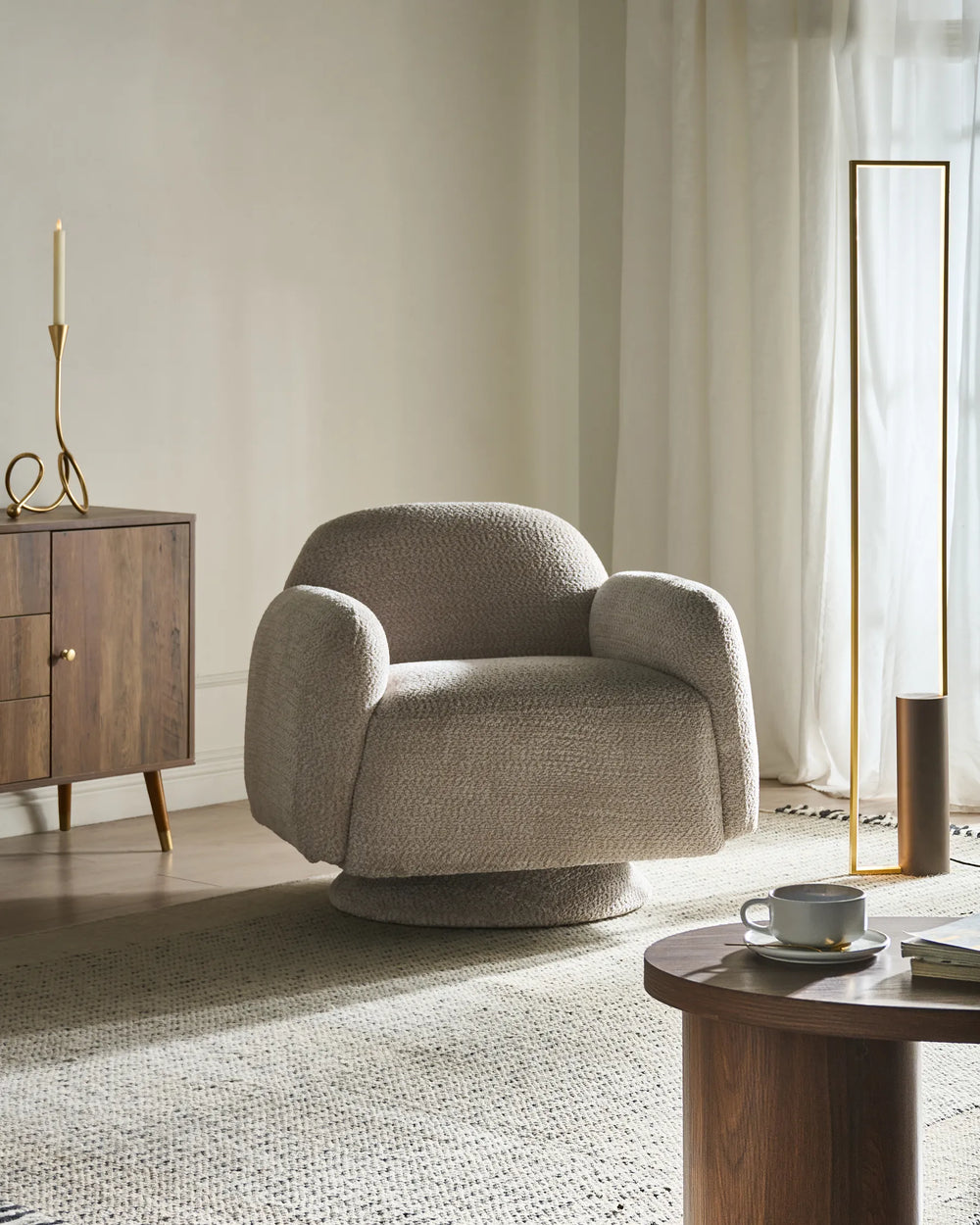 Upholstered in soft beige fabric.