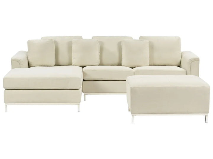 Beige sectional sofa with ottoman on a white background