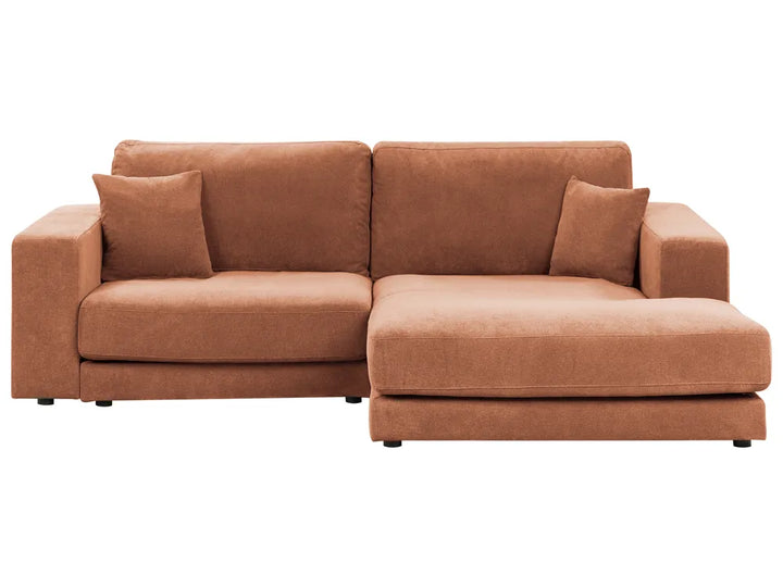 Brown sectional sofa with two cushions on a white background