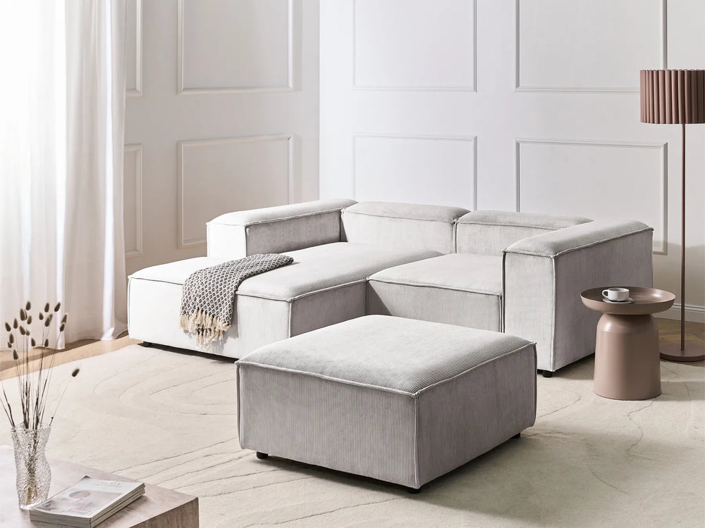 Right hand off-white jumbo cord corner sofa with ottoman