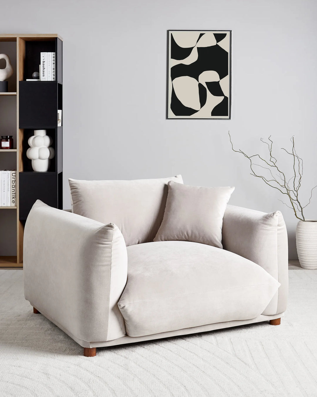 Beige sofa in a modern living room with abstract art on the wall.