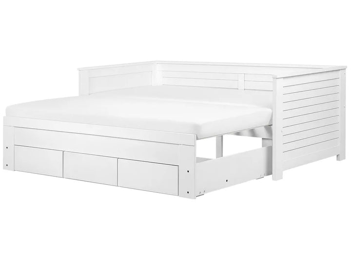 White wooden bed with drawers on a white background