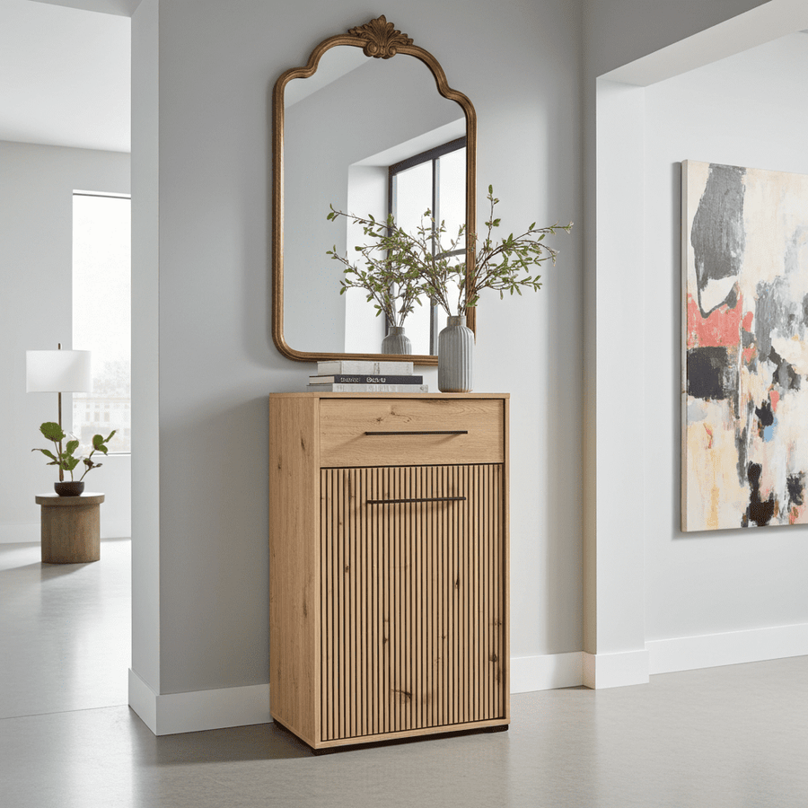 Wooden cabinet with decorative mirror and abstract painting in a modern interior setting