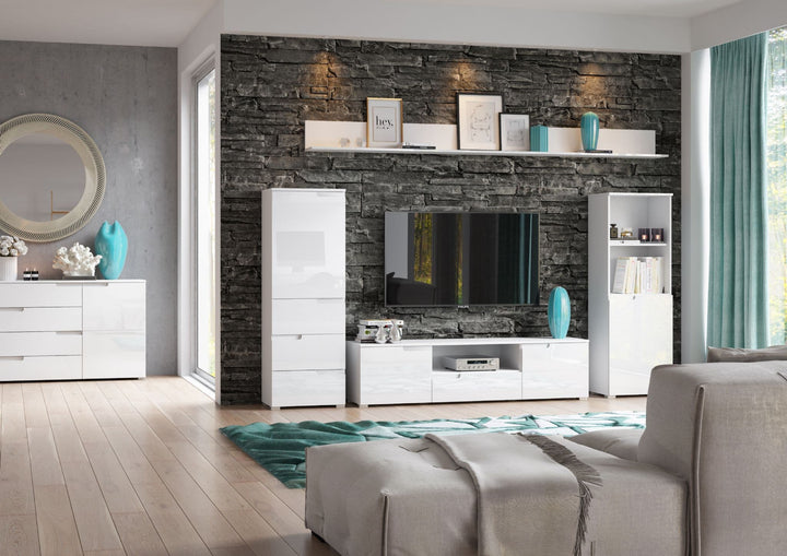 Modern living room with white furniture, gray sofa, and decorative items.
