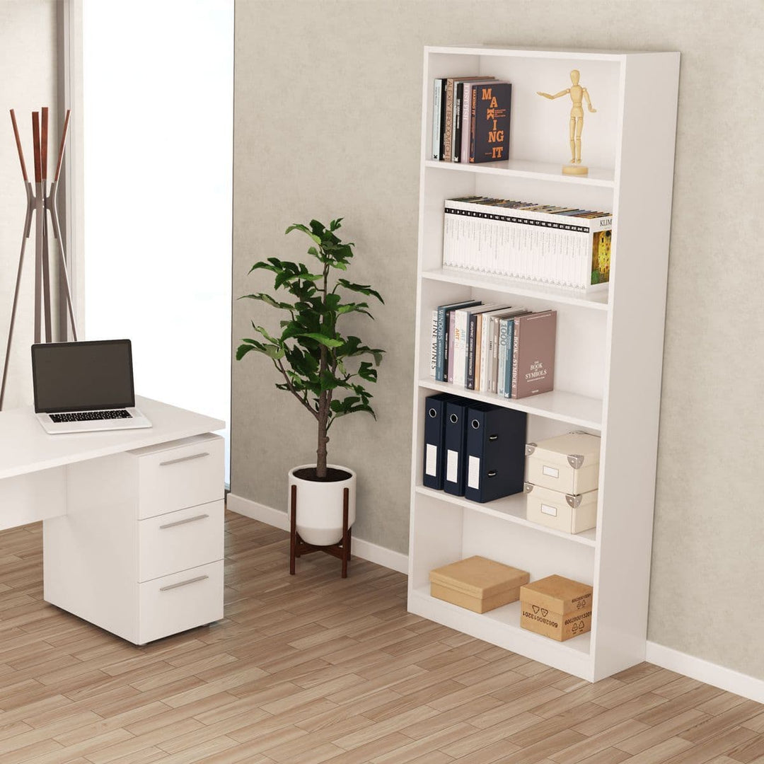 Home office with a desk, bookshelf, and plant