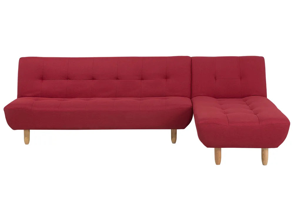 Red sectional sofa on a white background