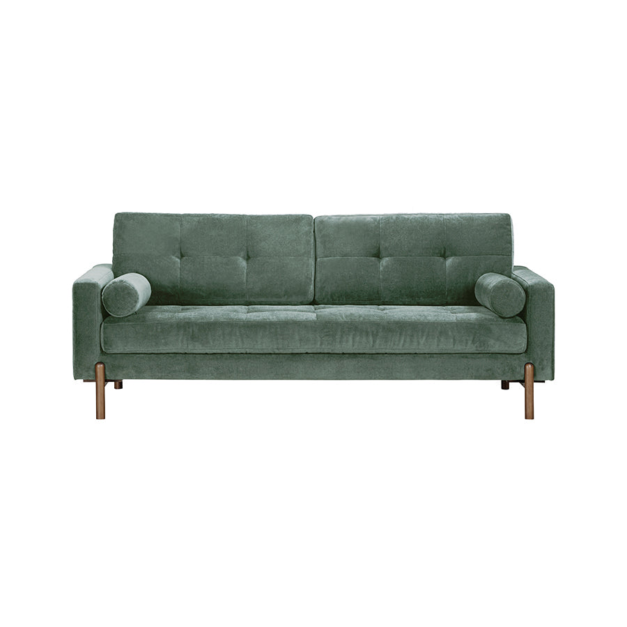 Green sofa with buttoned backrest on a white background
