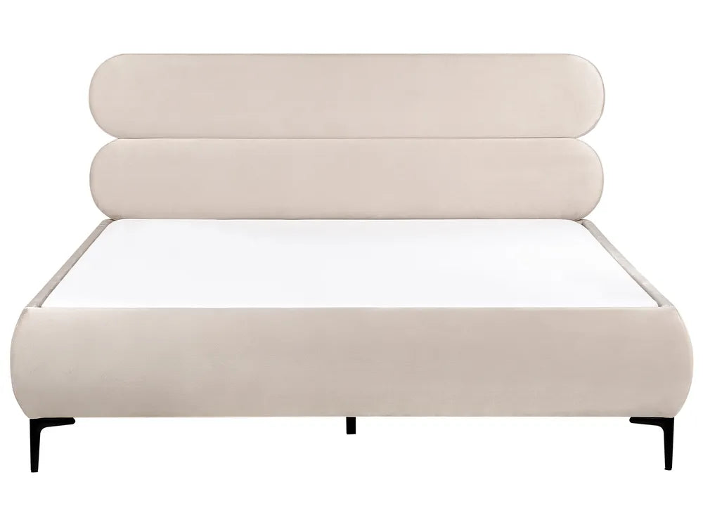 Beige upholstered bed with a white mattress on a white background