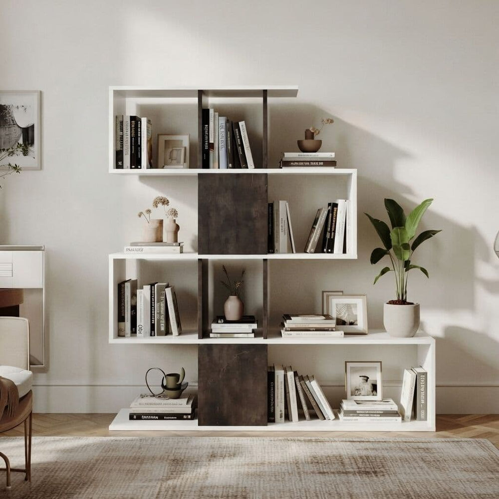 White bookshelf with books, plants, and decor in a room with a chair and rug.
