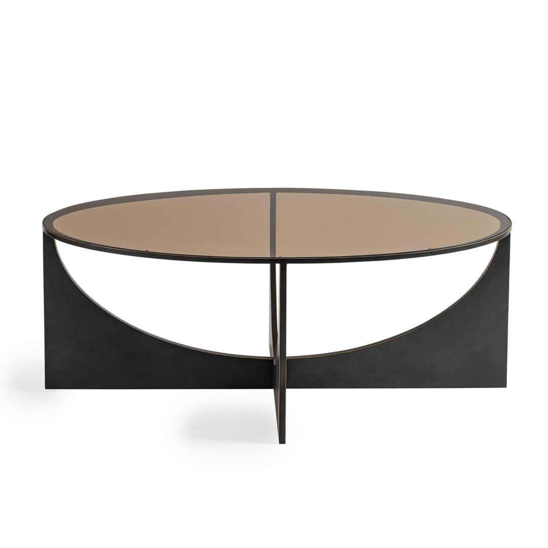 Round coffee table with a black metal frame and beige top 