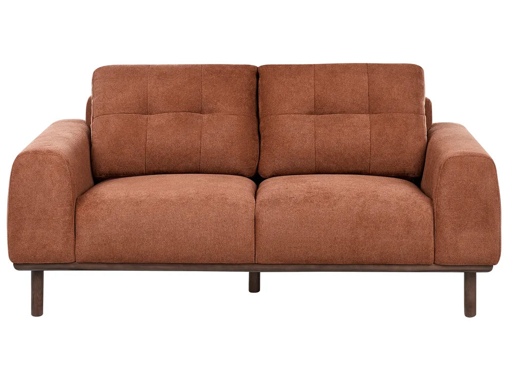 Brown sofa with wooden legs on a white background