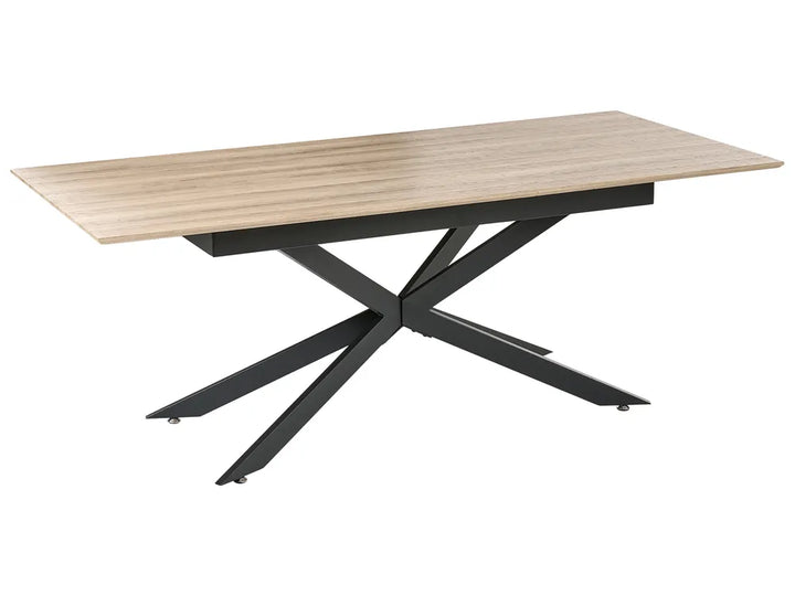 Table with wooden top and black metal legs on a white background