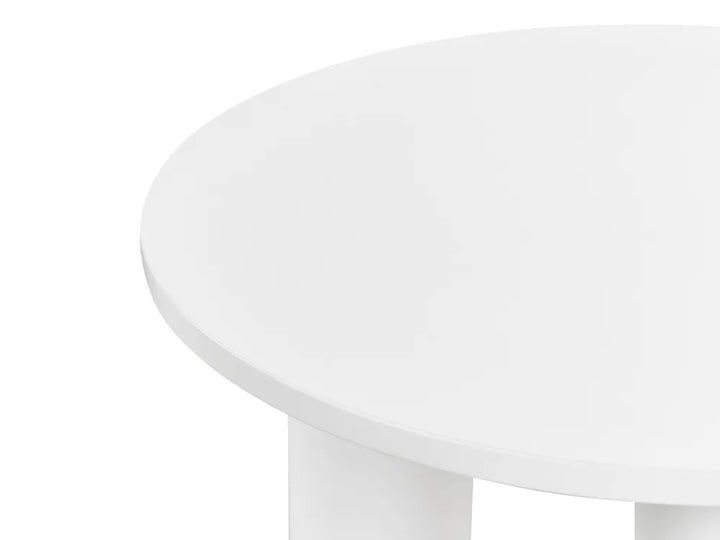 Round white table on a white background