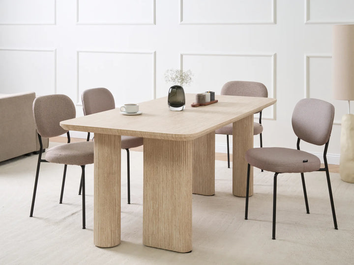 Dining table with chairs in a modern room setting