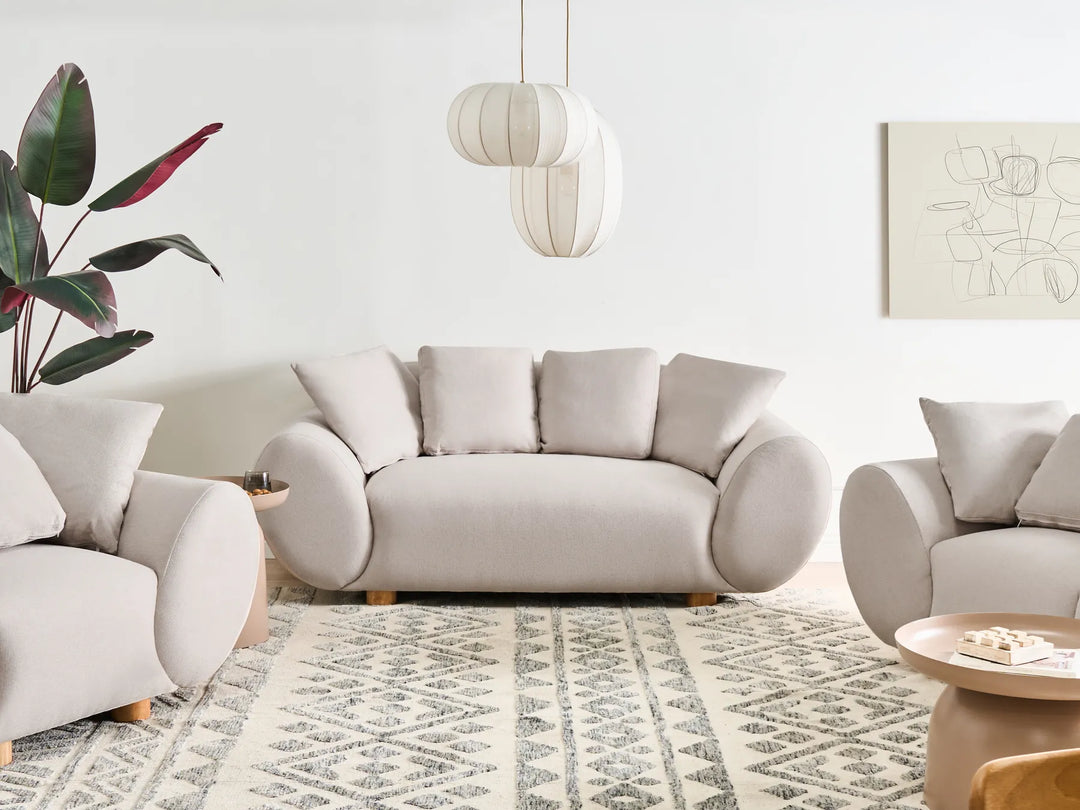 2 seater light beige sofa with soft upholstery and modern design