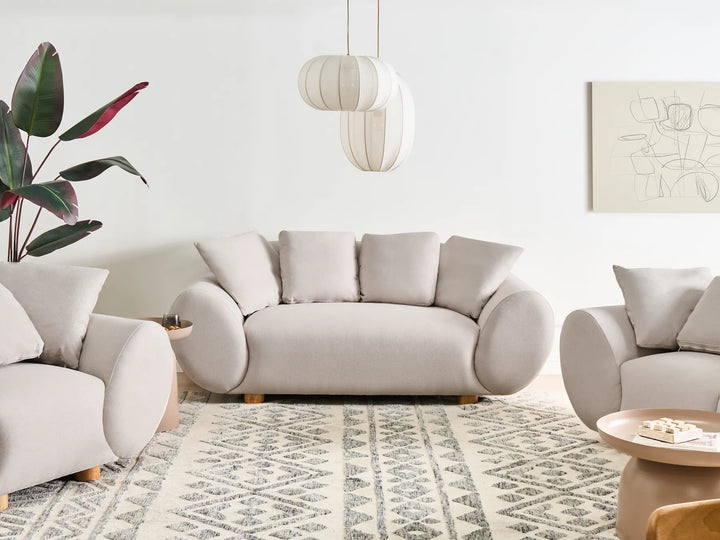 2 seater light beige sofa with soft upholstery and modern design