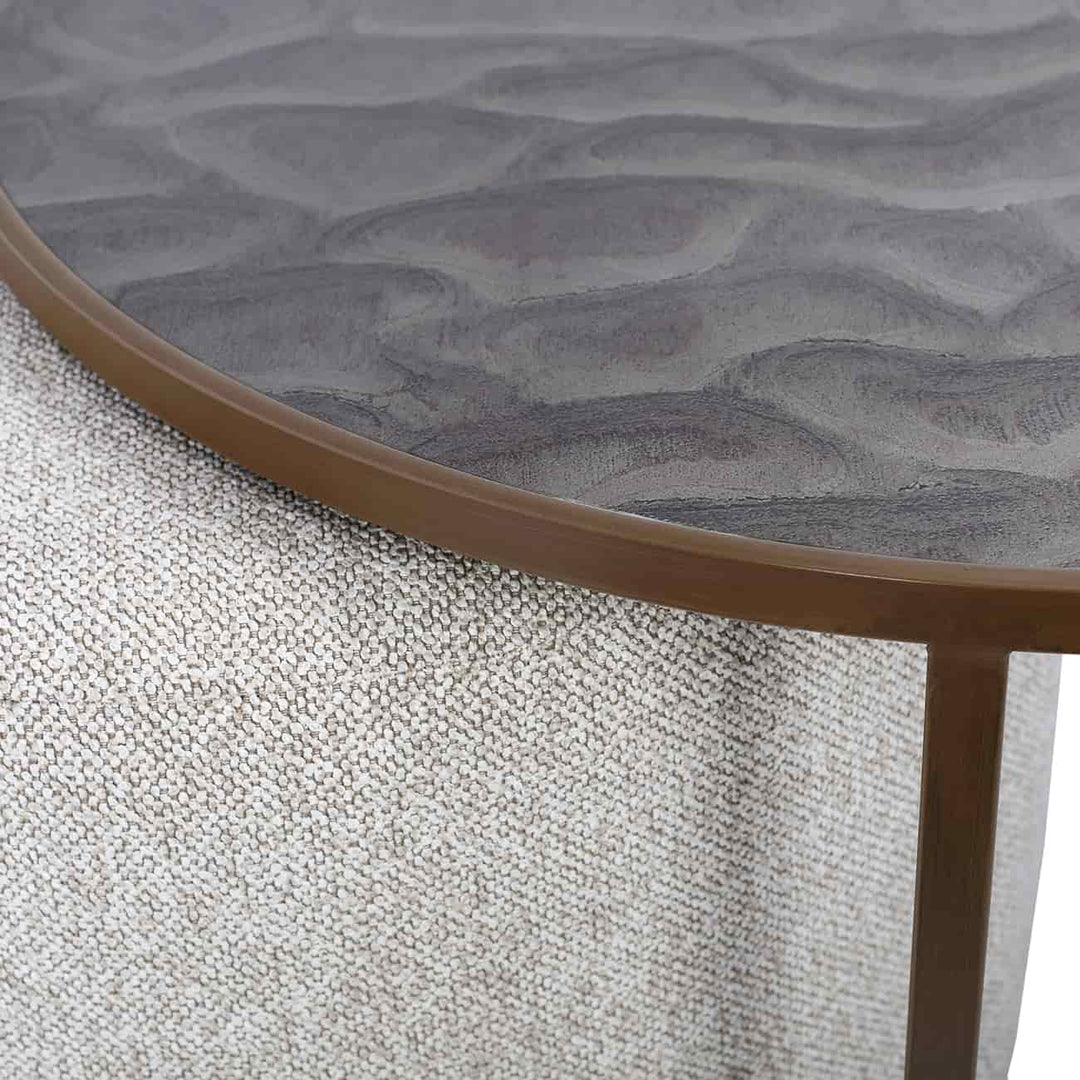 Round textured table with wavy surface design