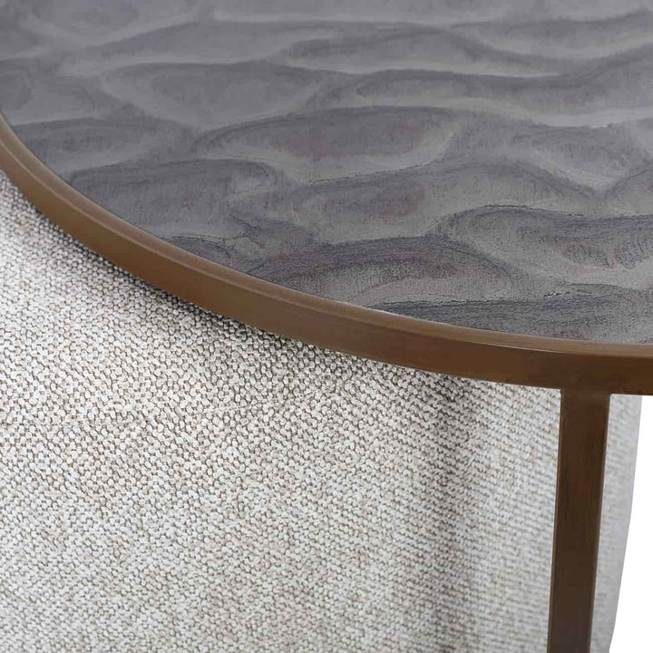 Round textured table with wavy surface design