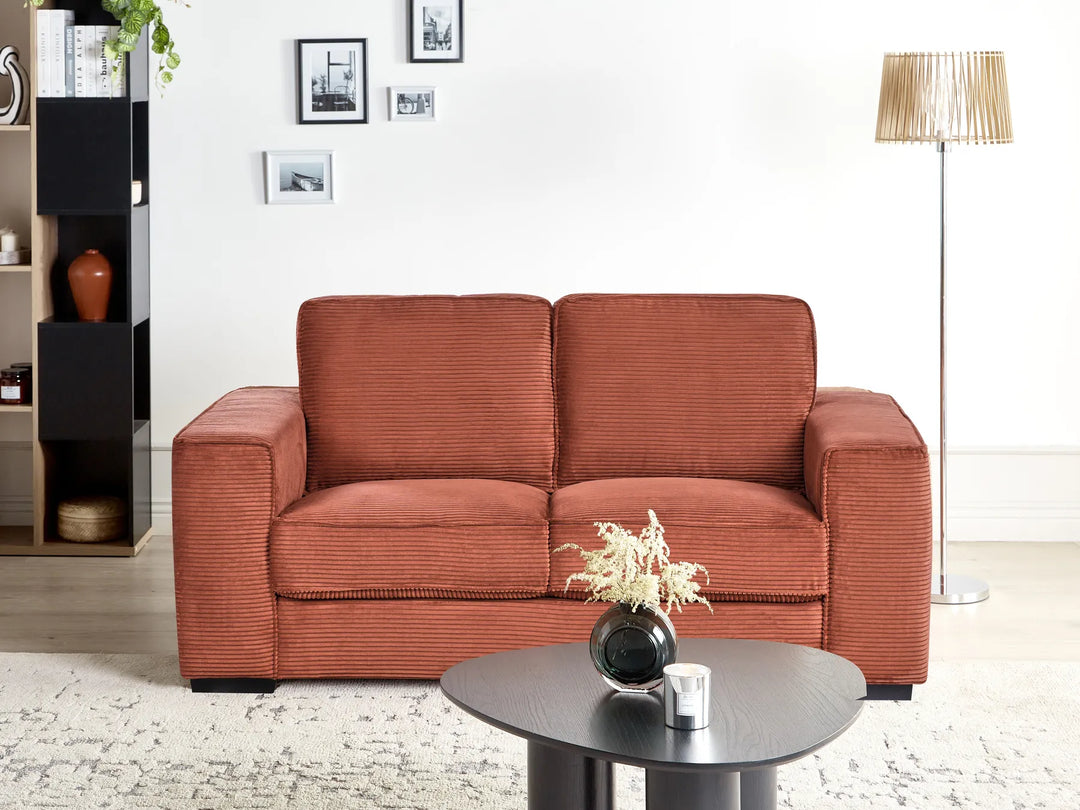 2 seater red cord sofa with minimalist legs