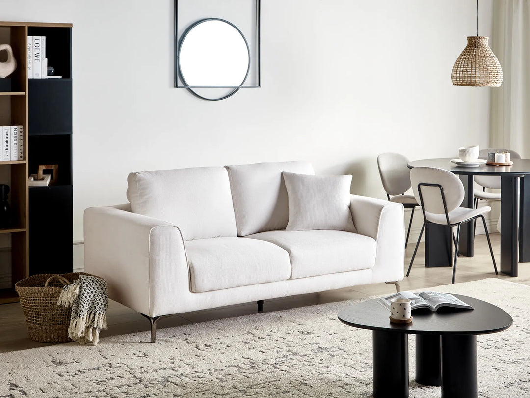 2 seater white sofa with soft upholstery and modern design