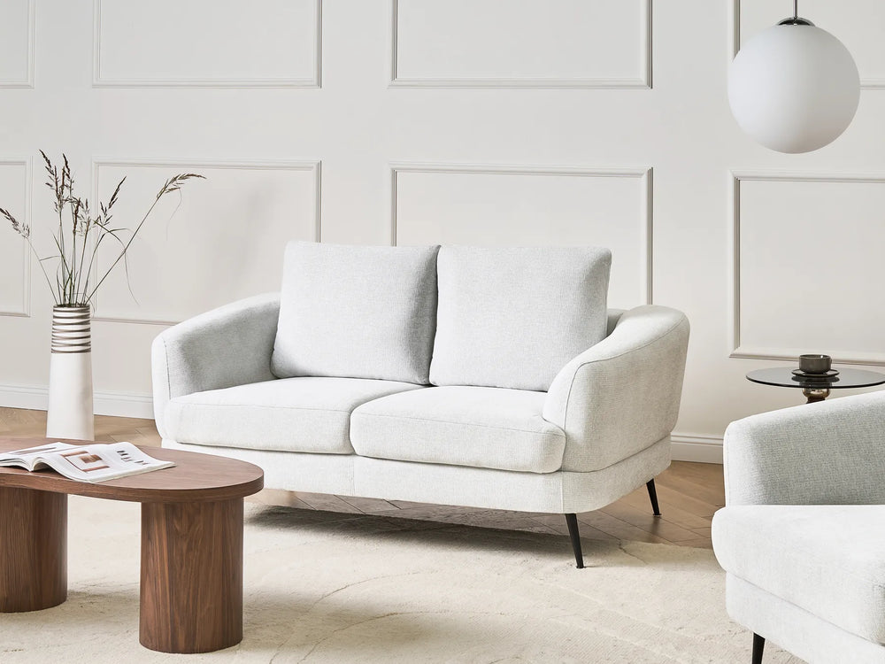 2 seater off‑white fabric sofa with soft upholstery