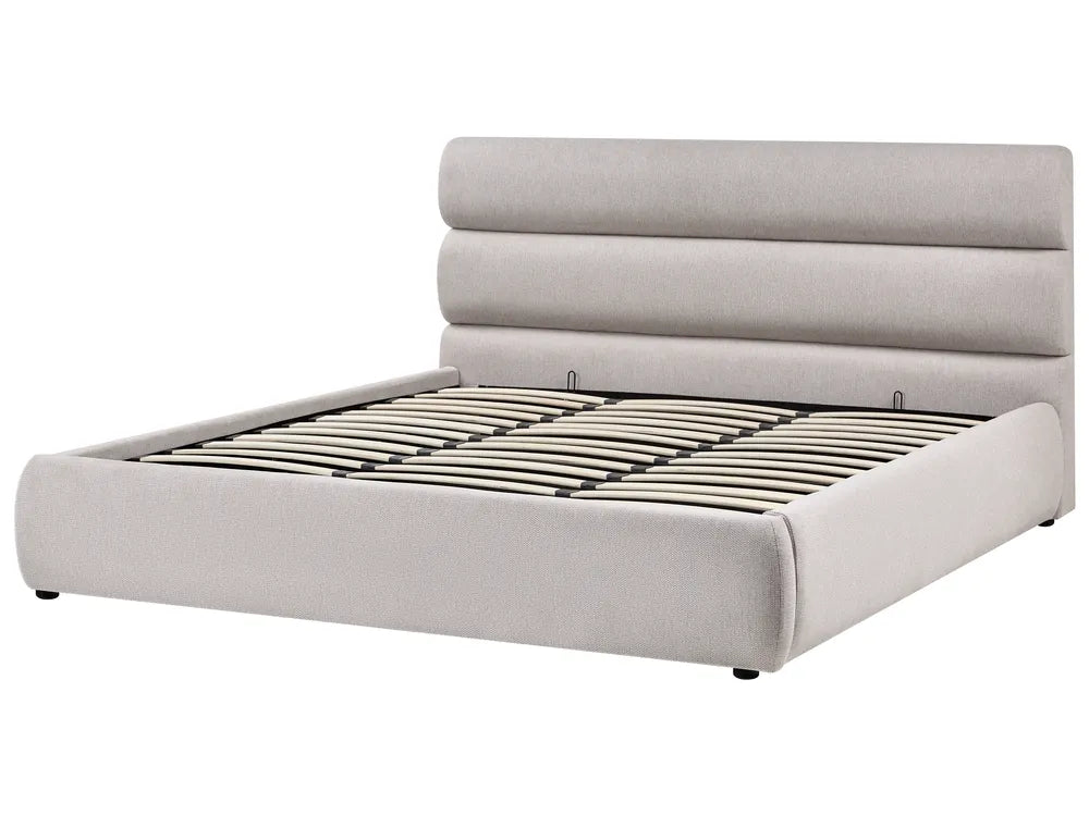 Gray upholstered bed with a tufted headboard on a white background