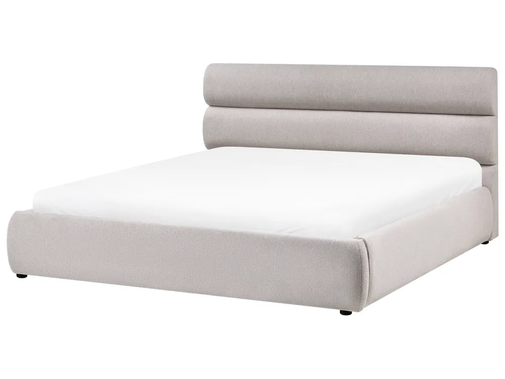 Modern bed with light gray upholstered headboard on a white background