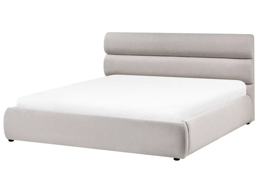 Modern bed with light gray upholstered headboard on a white background
