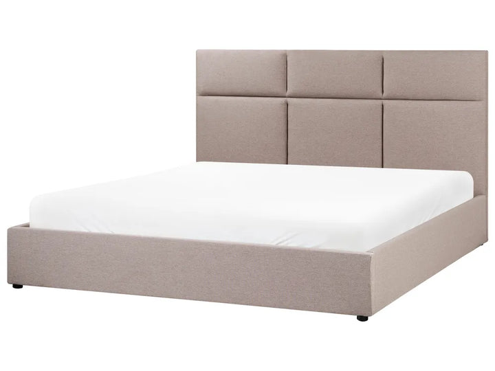 Beige upholstered bed with white mattress on a white background