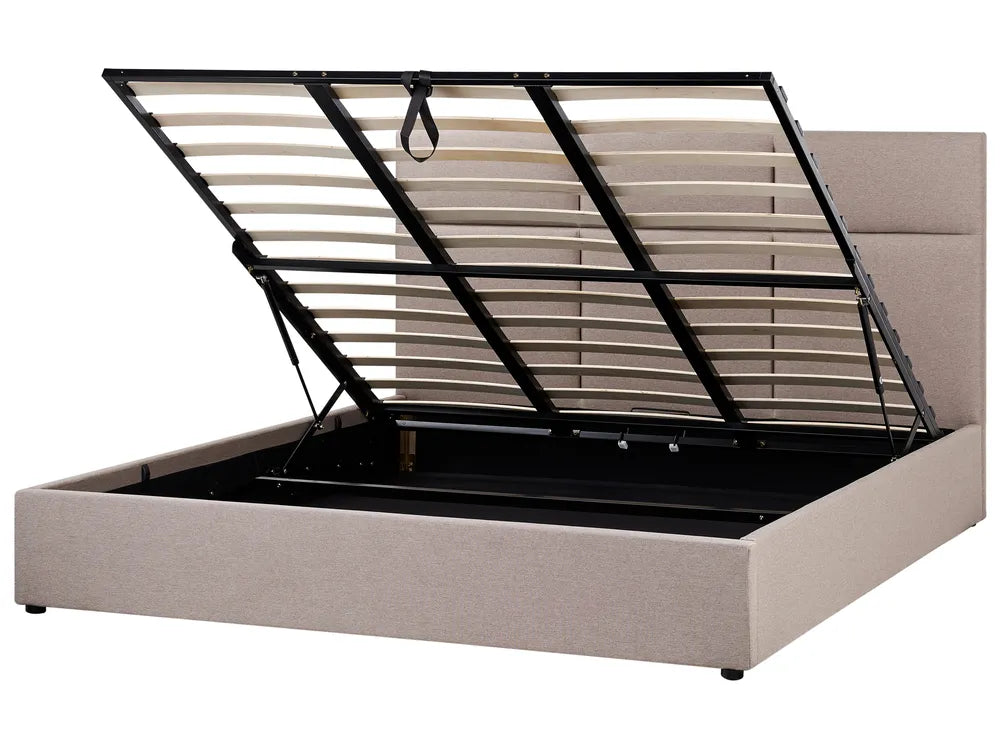 Beige upholstered bed frame with black metal headboard on a white background