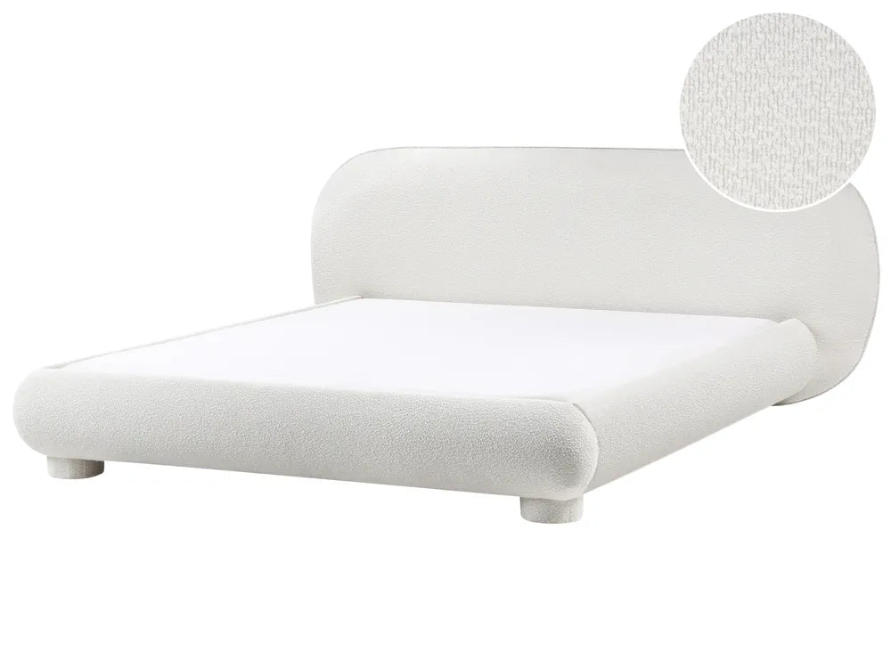White upholstered bed with a close-up detail of the fabric texture on a white background