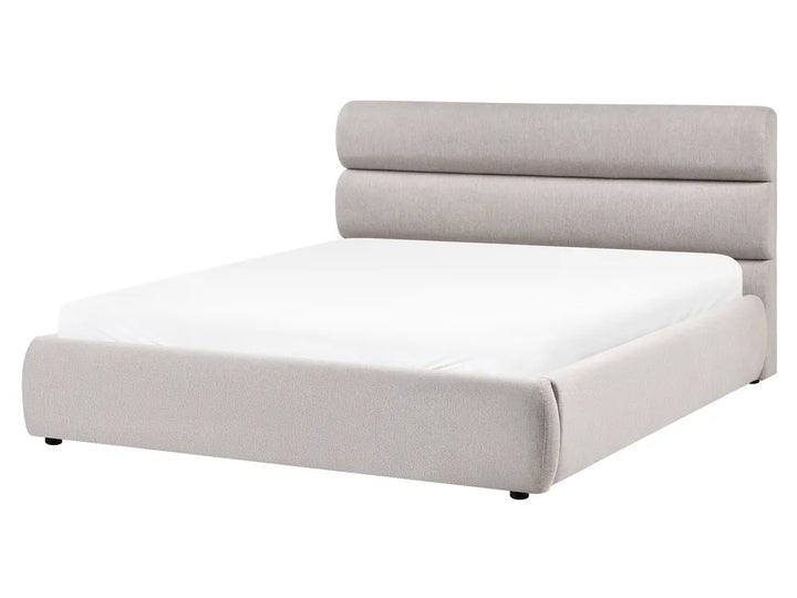 Gray upholstered bed with white mattress on a white background