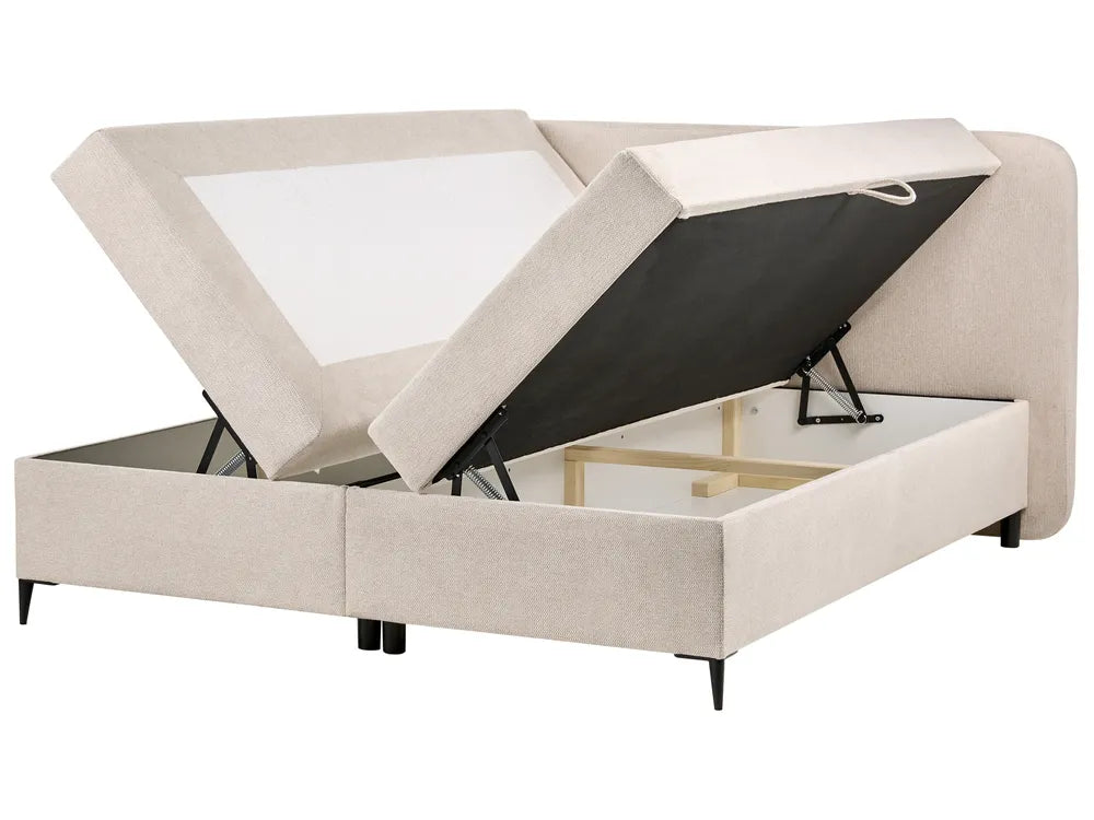 Beige upholstered bed with storage compartments on a white background