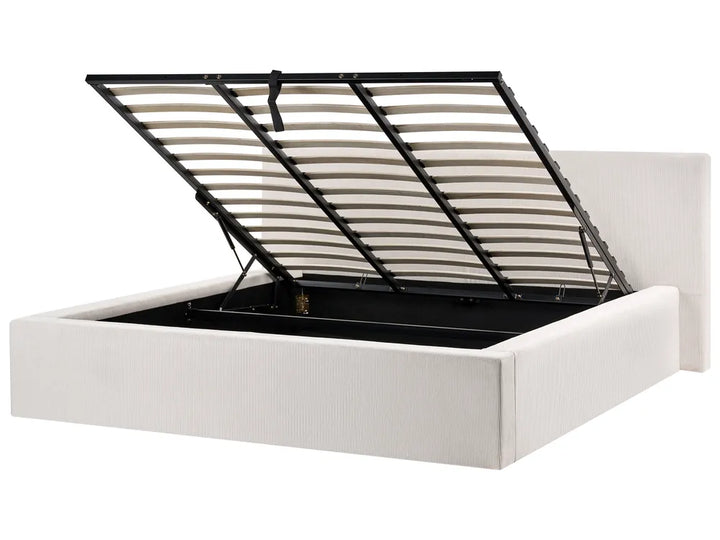 White bed frame with black metal headboard on a white background