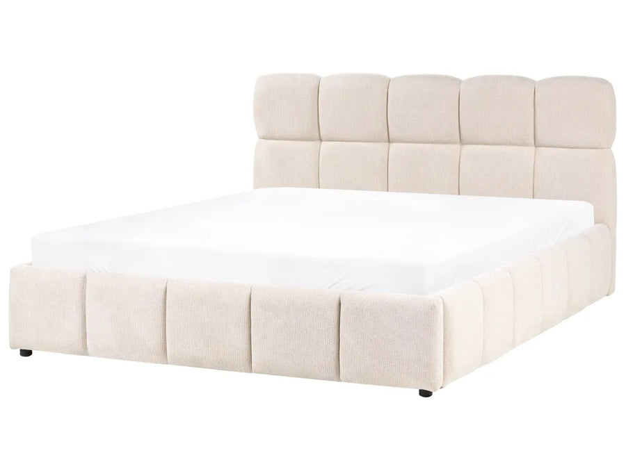 Beige upholstered bed with white mattress on a white background