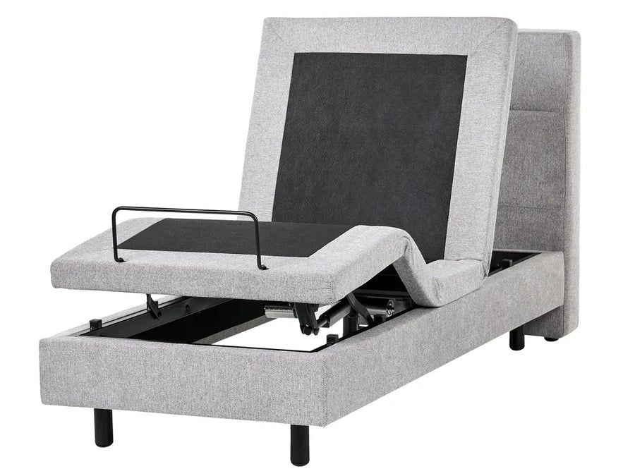 Gray adjustable bed with open storage compartment on a white background
