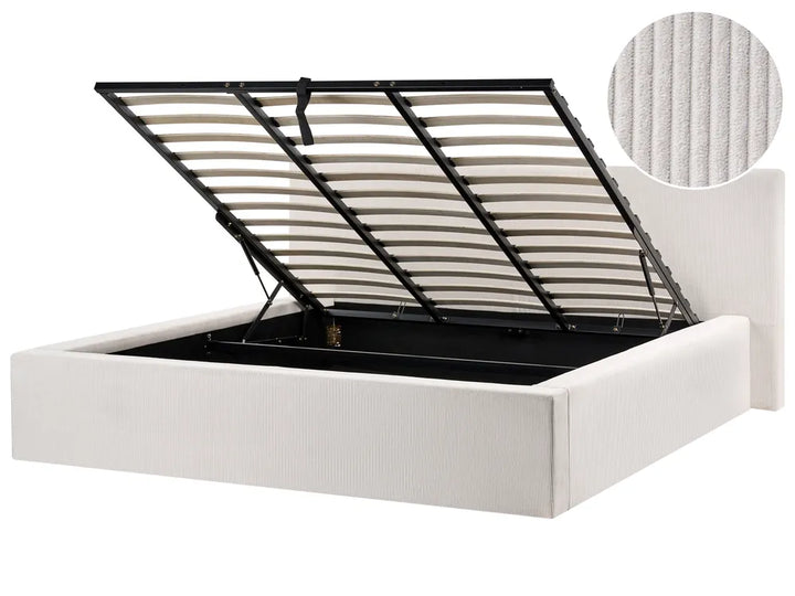 White bed frame with black metal headboard on a white background