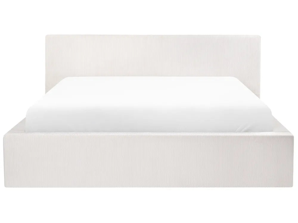 White bed frame with white mattress on a white background