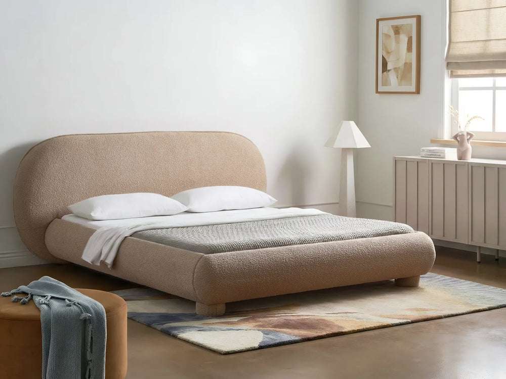 Bouclé upholstered bed with rounded headboard taupe