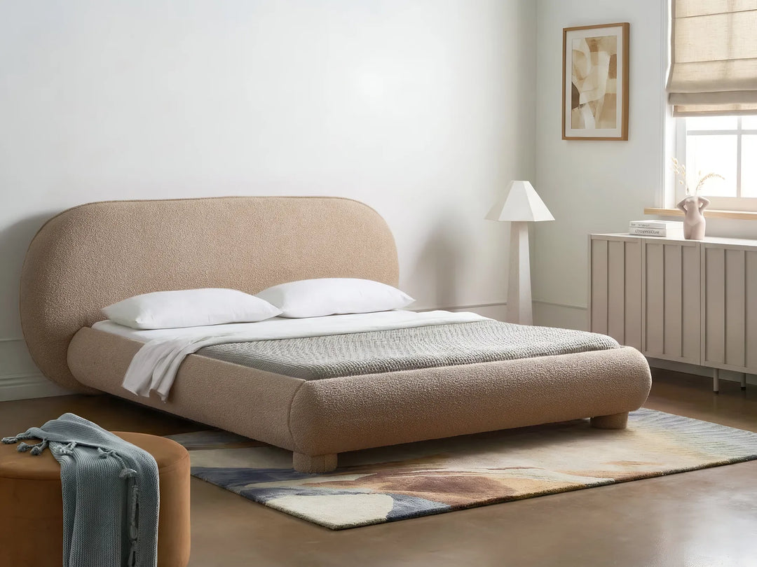 Bouclé upholstered bed with rounded headboard taupe