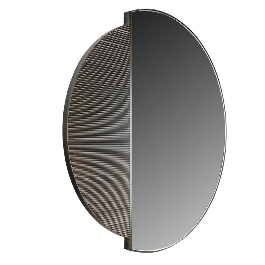 Round mirror with textured half-circle design on a white background