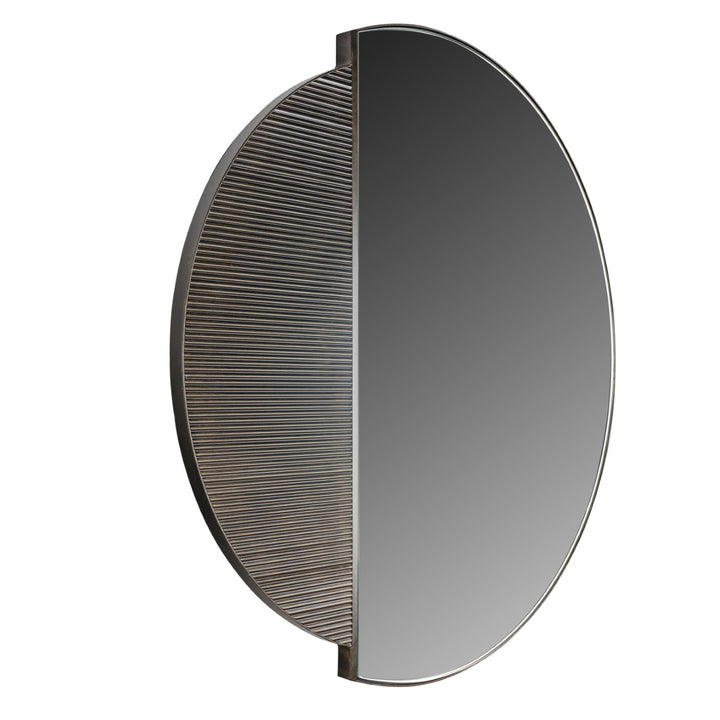 Round mirror with textured half-circle design on a white background