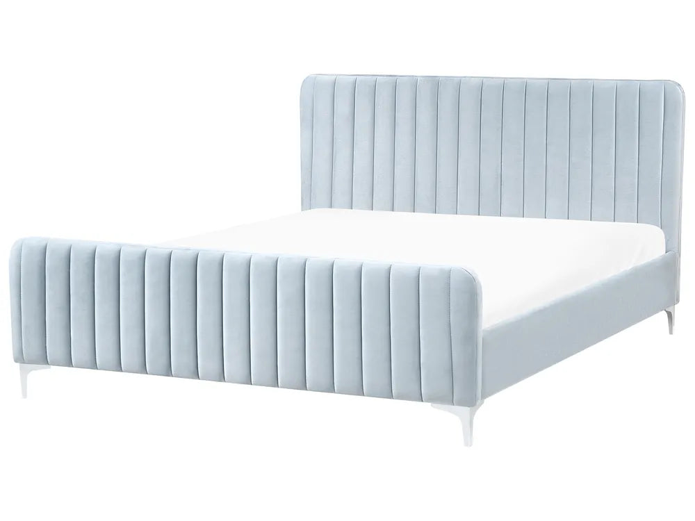 Light blue upholstered bed with white mattress on a white background
