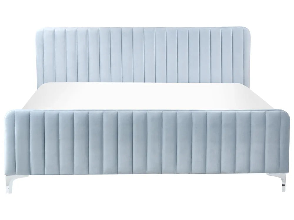Blue upholstered bed with white mattress on a white background