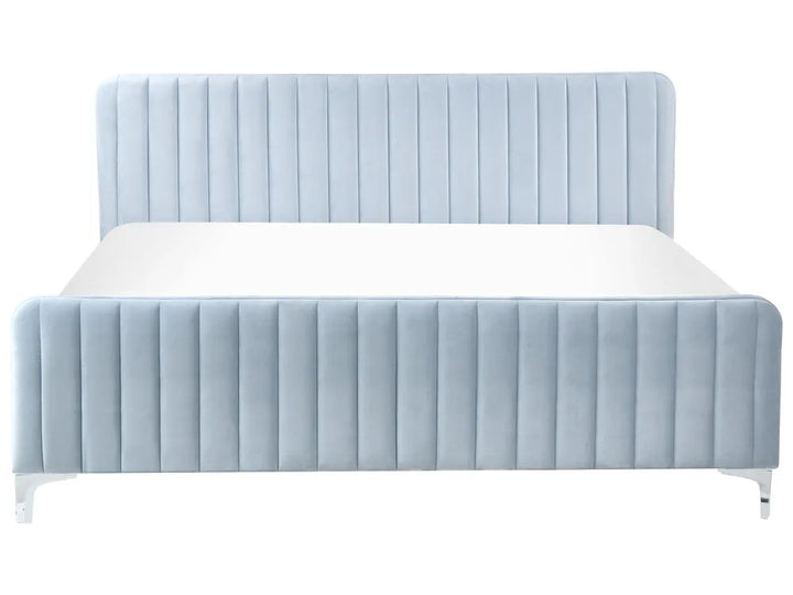 Blue upholstered bed with white mattress on a white background