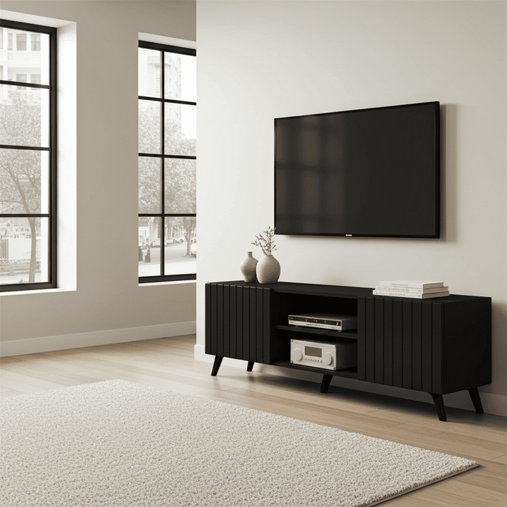 Modern living room with a black TV stand and mounted television.